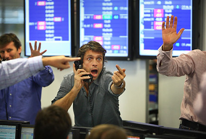 The Press Photographer’s Year 2009, First Prize, News Folio – Peter Macdiarmid, Getty Images: A broker on ICAP's dealing floor in London calls for prices as the markets react to the day's interest rate cut. 9th October 2008.